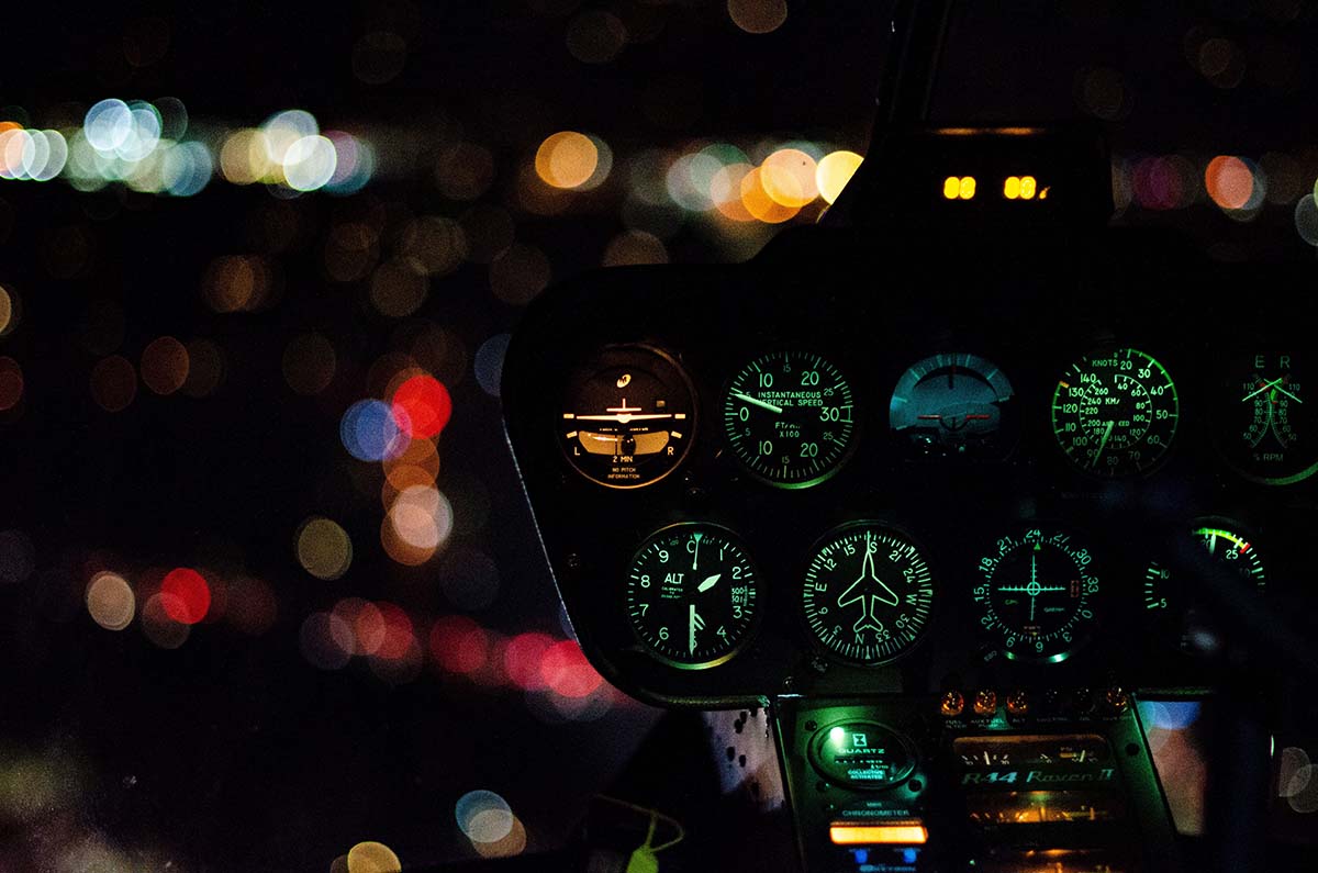 Aircraft cockpit at night.
